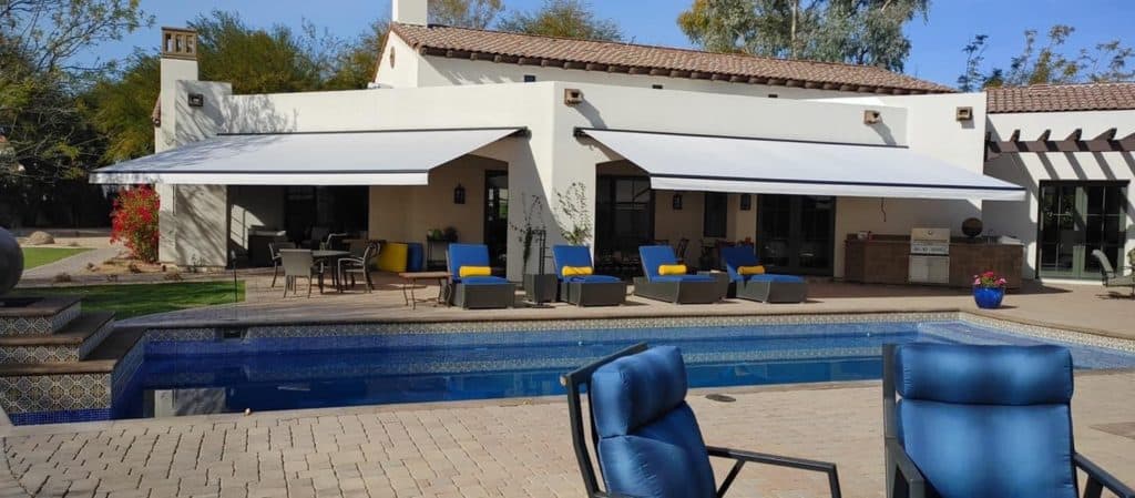 Custom retractable patio shades for poolside pergolas.