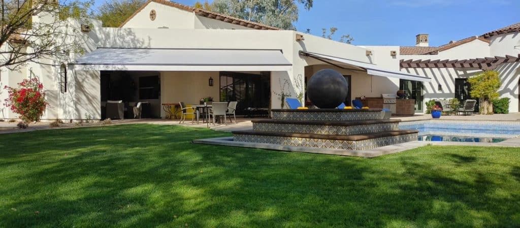 Elegant outdoor patio with custom shade sails and covers by All Pro Shade Concepts. Perfect for outdoor living and sun protection.