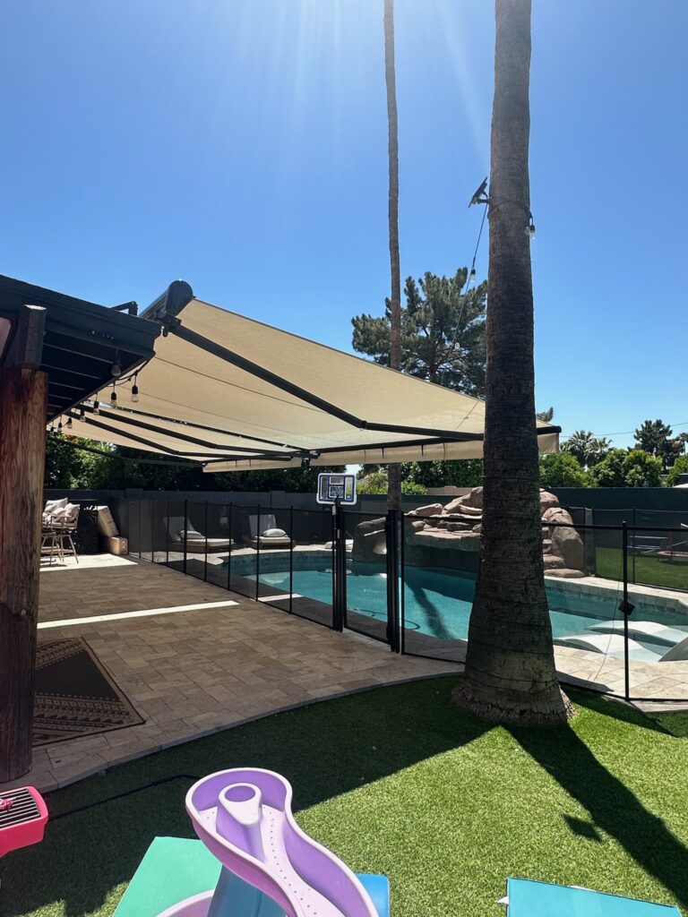 Motorized Retractable Awnings for Expanded Entertainment Space Pool