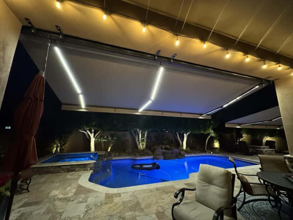 retractable awning with dimmable led lights poolside