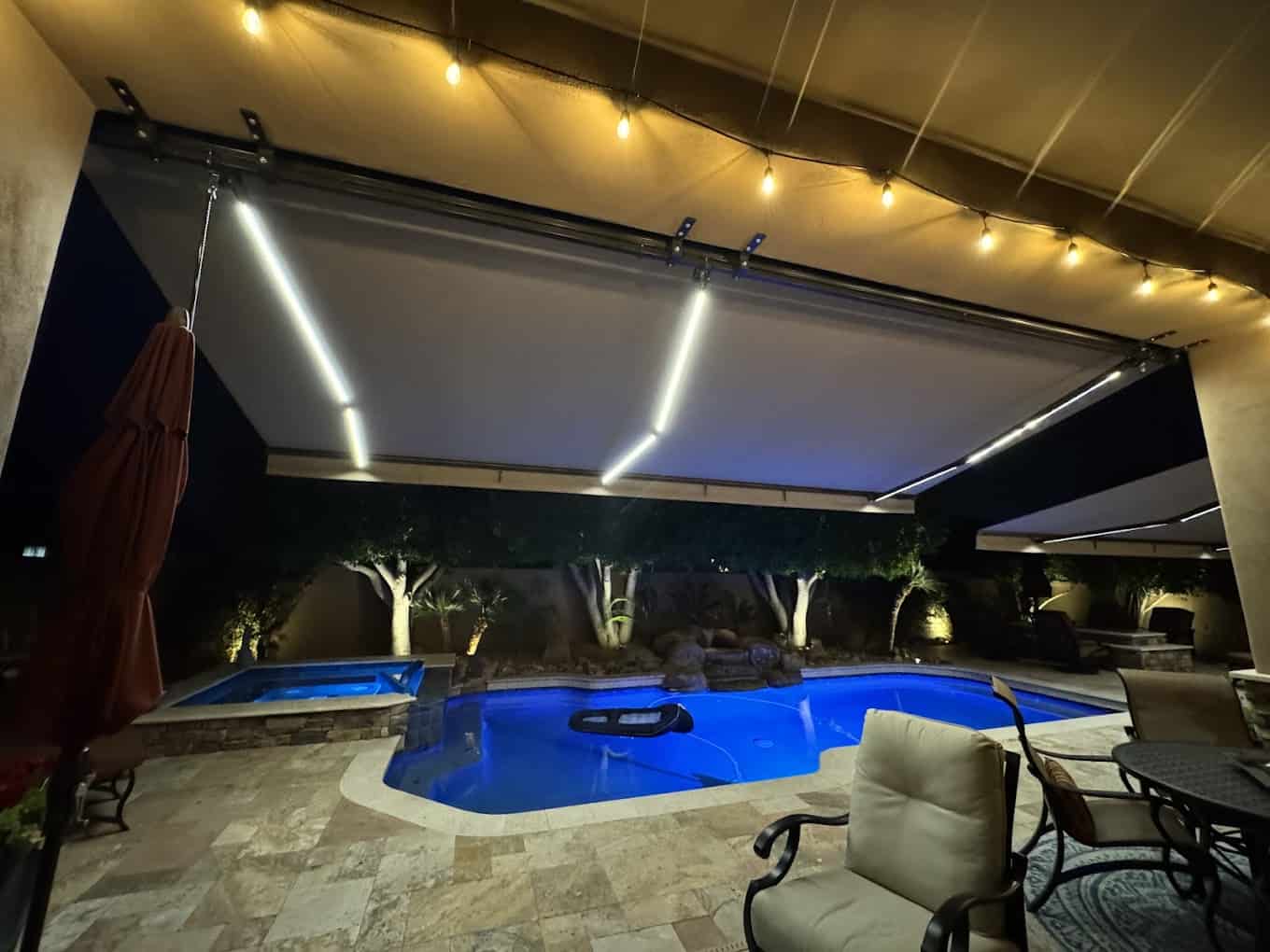retractable awning with dimmable led lights poolside