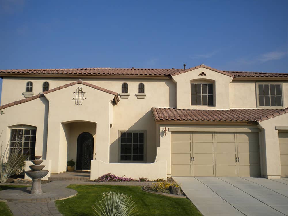 Home Exterior With Window Sun Screens for Heat and Glare Reduction