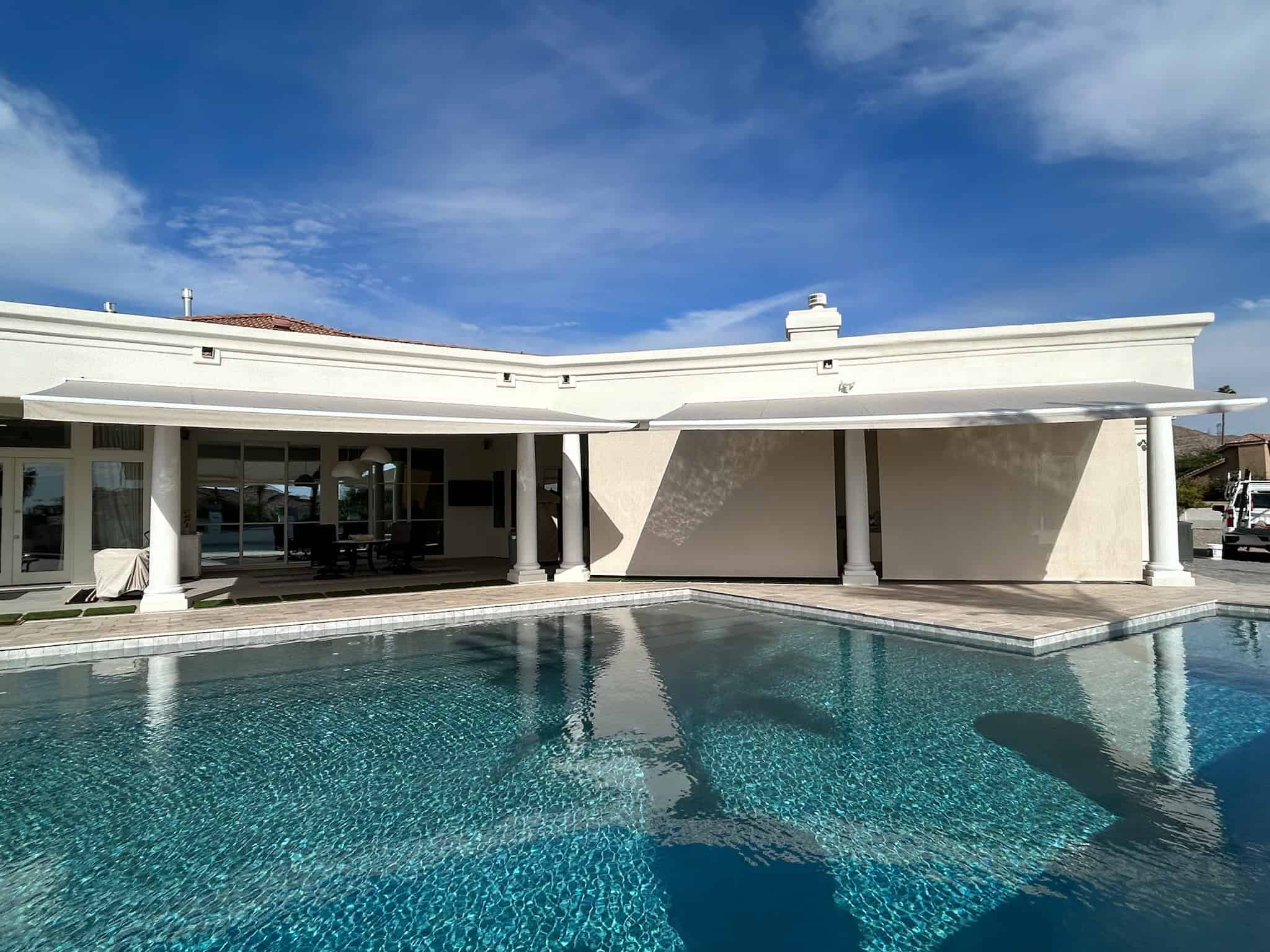 Retractable Awnings and Patio Shade Providing Comfort Over Poolside Area