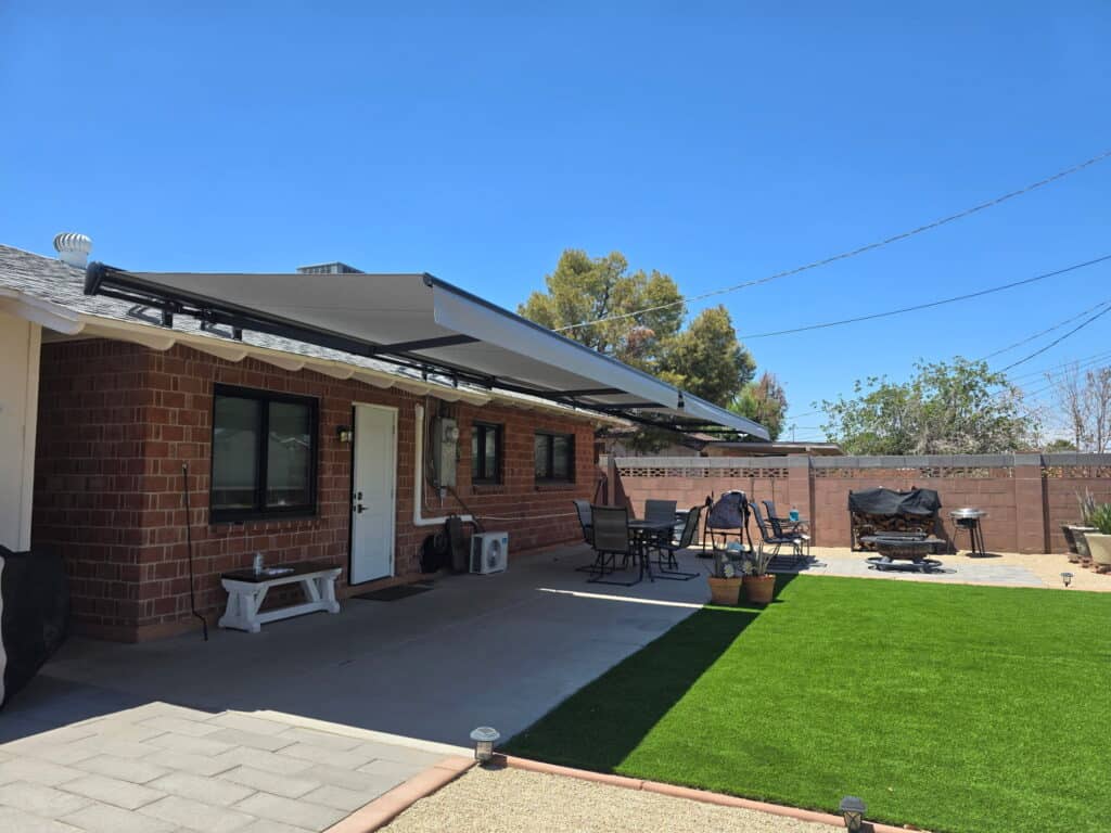 Retractable Awning Extending Over Backyard Patio Seating