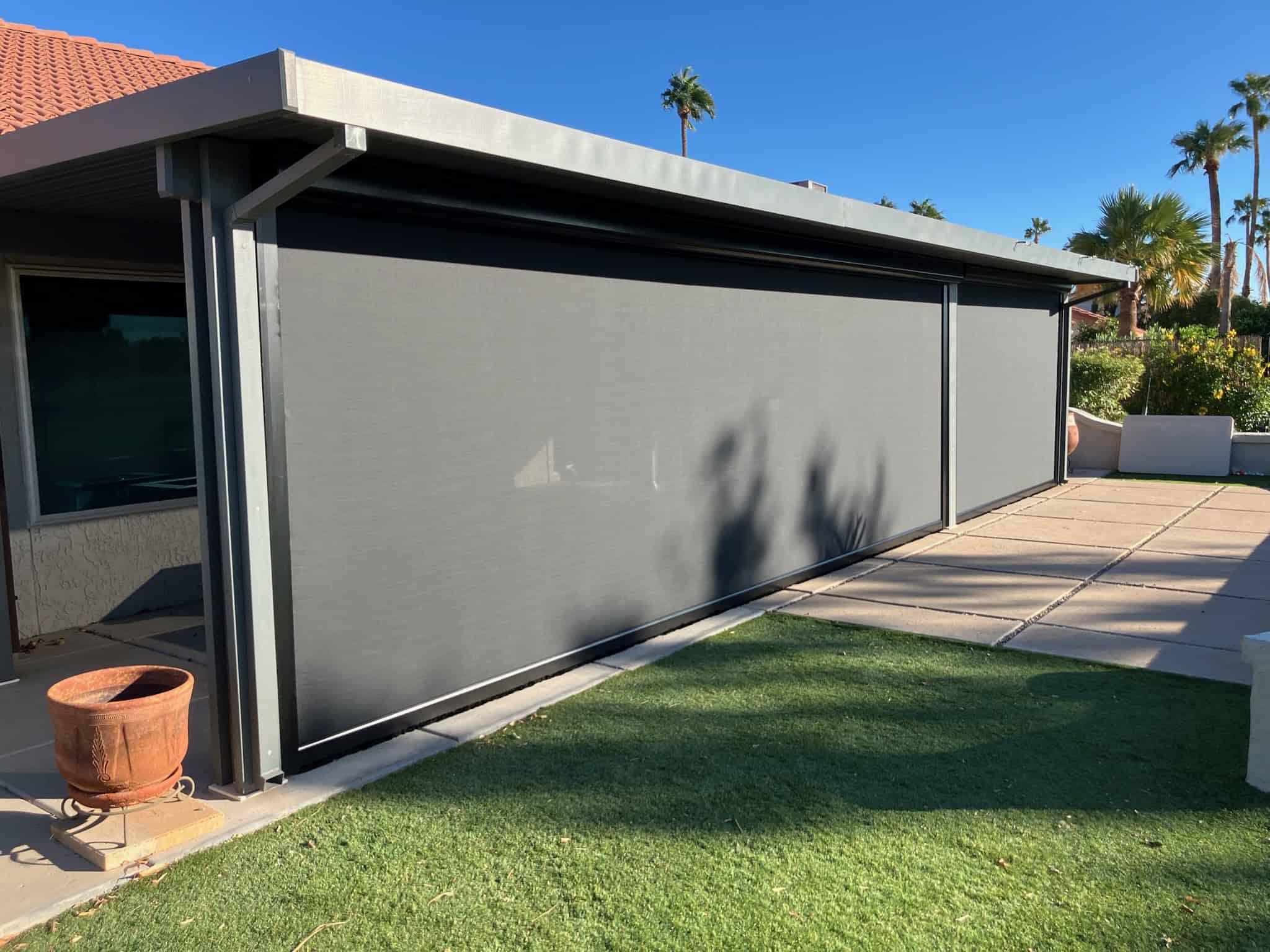 Drop Roller Shades Beside Artificial Turf