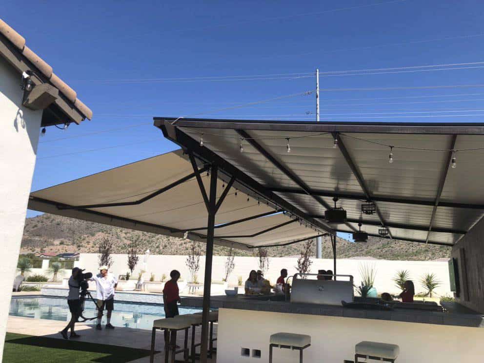 Retractable Awning is Extended Over a Mini-Bar and Grill Area Next to a Pool