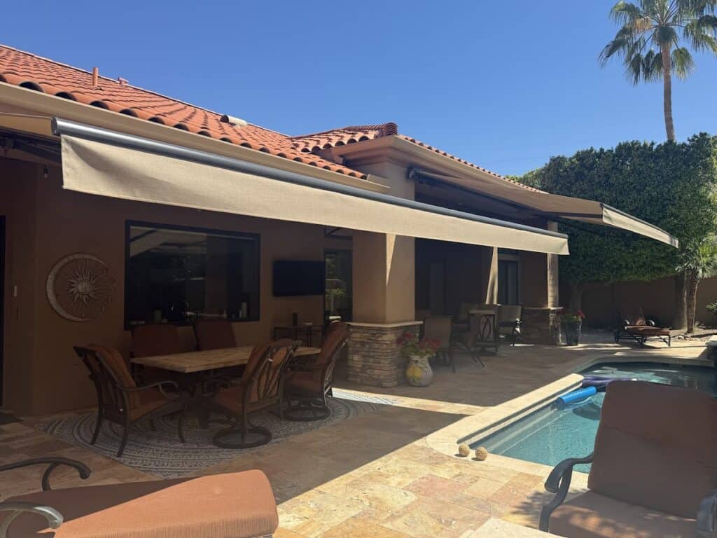 Large Retractable Awning Provides Shade Over a Massive Outdoor Living Space with a Pool
