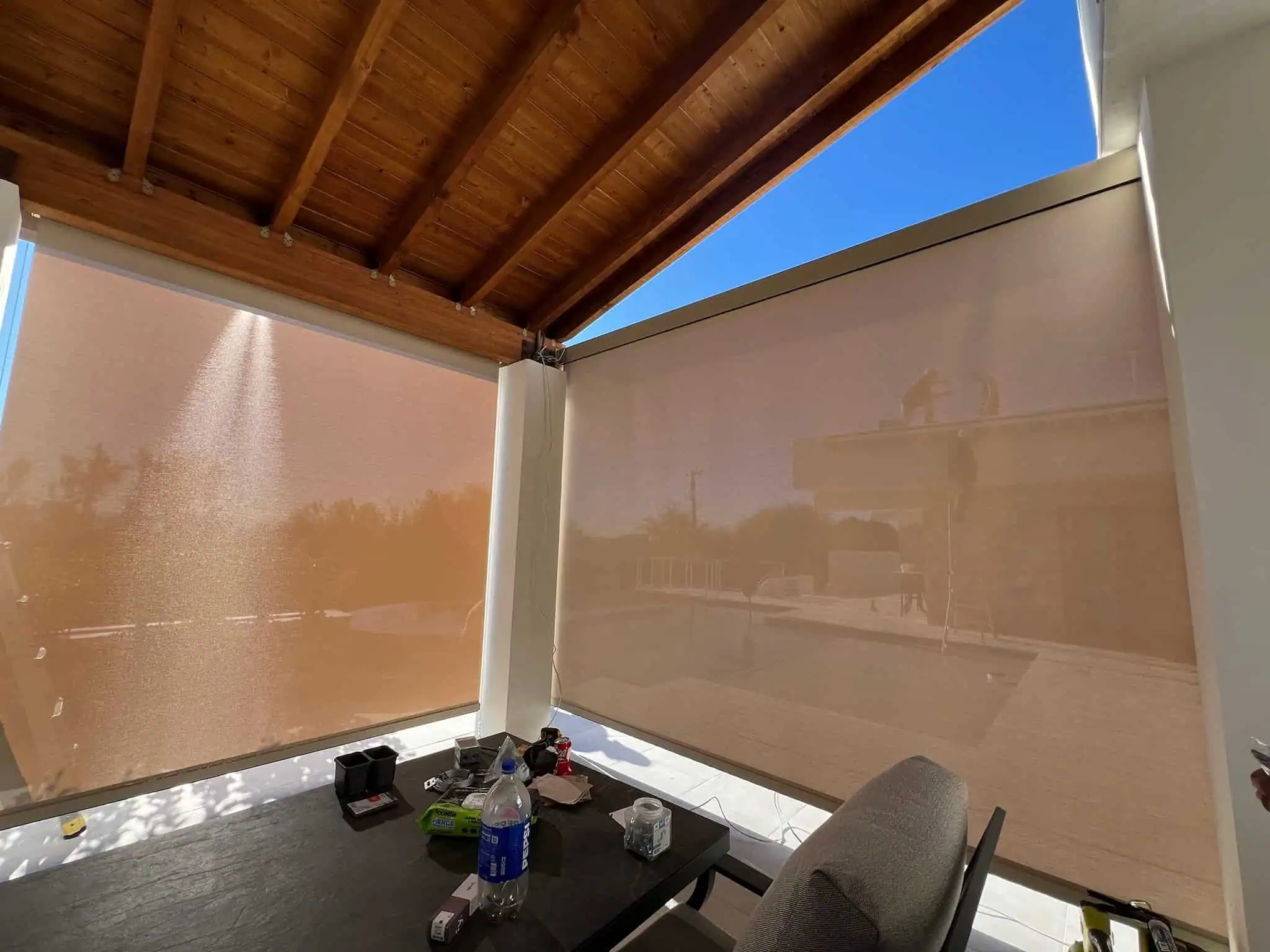 Covered Patio With Drop-Down Shades for Sun and Privacy Control
