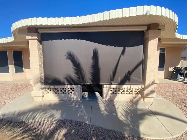 Exterior Drop Shade Covering a Sunny Patio Opening