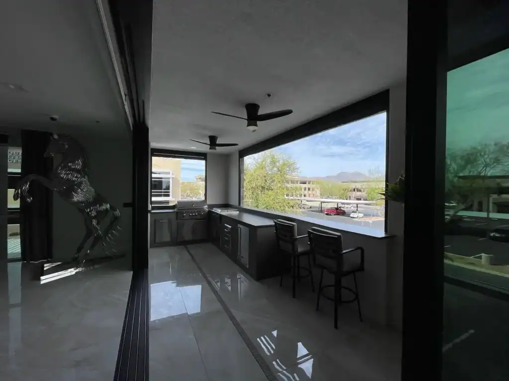 Covered Outdoor Kitchen and Dining Area with Open View