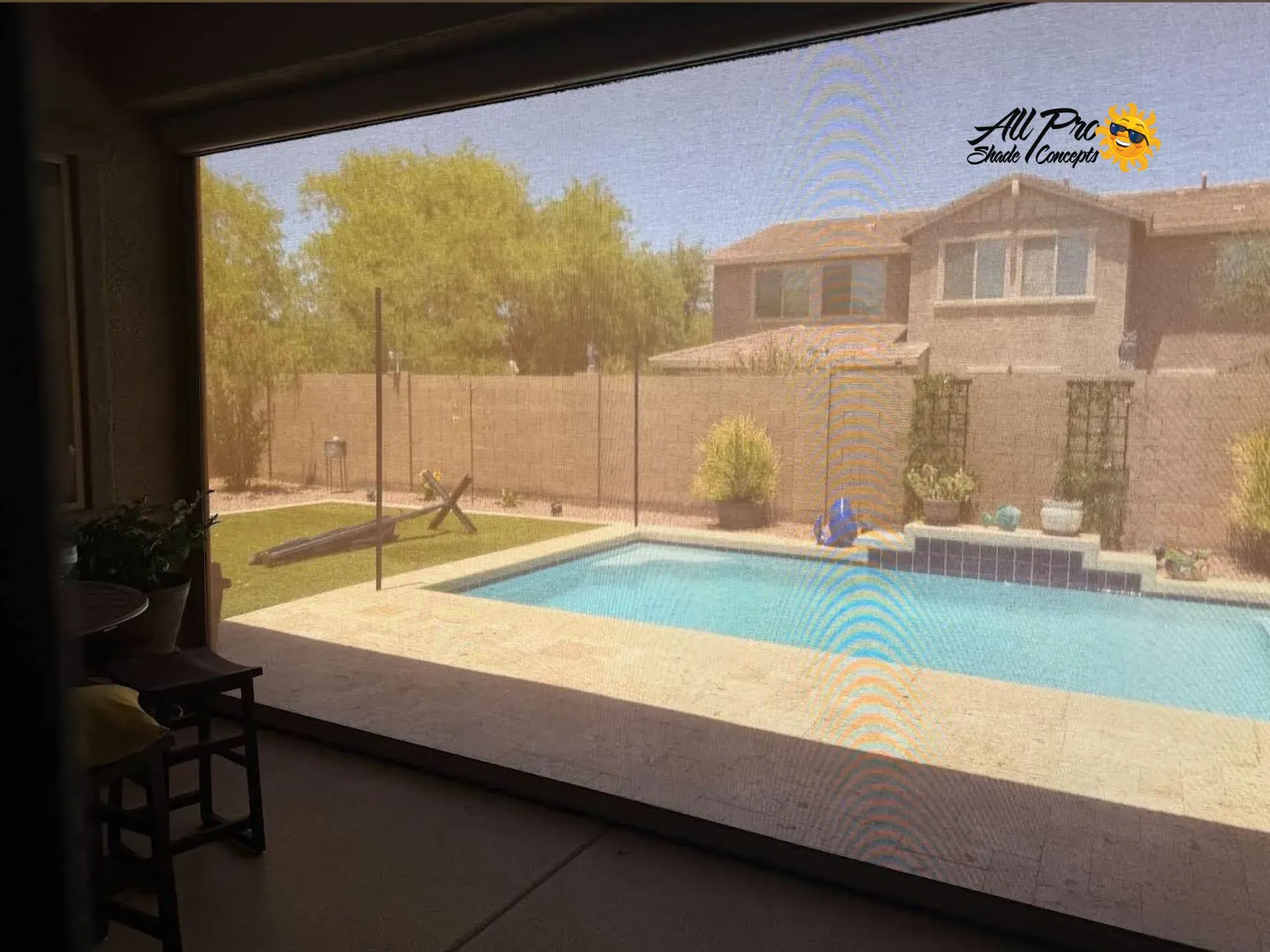 Patio Privacy Screen Overlooking Pool and Two-Story Home