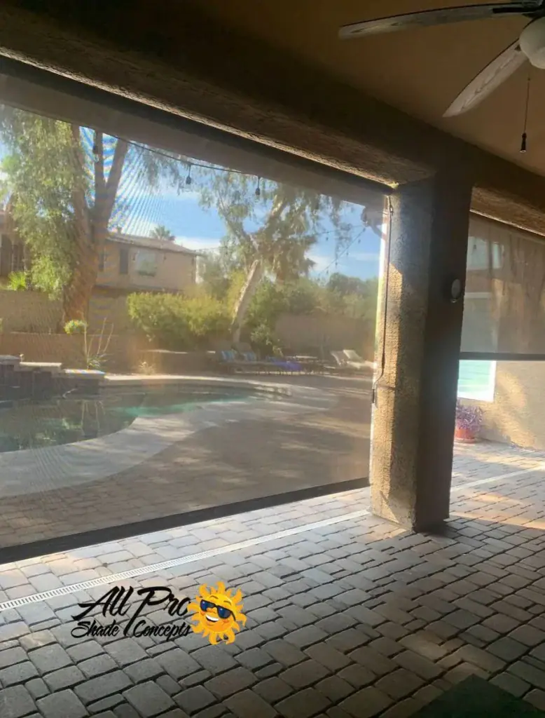 Two Patio Privacy Shades Overlooking a Tree-Lined Backyard Pool